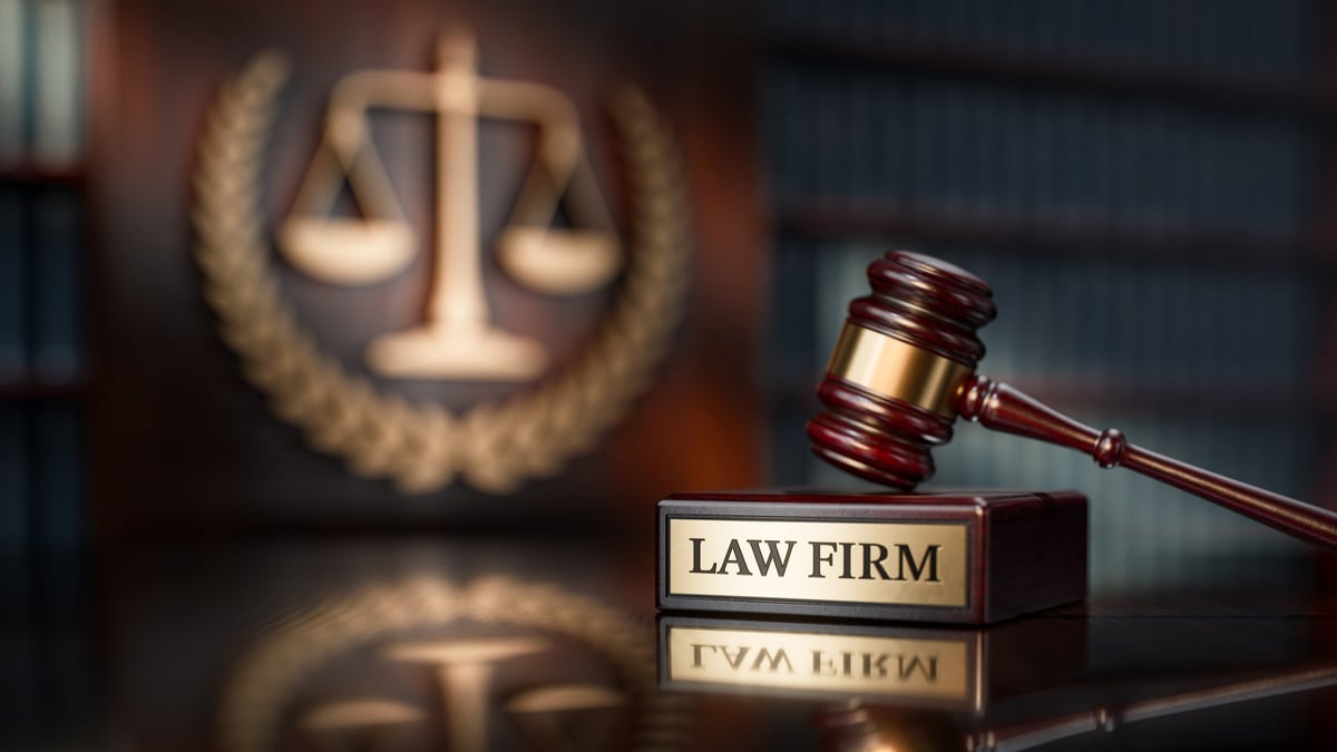 Law Firm: Judge's Gavel as a symbol of legal system and wooden stand with text word.